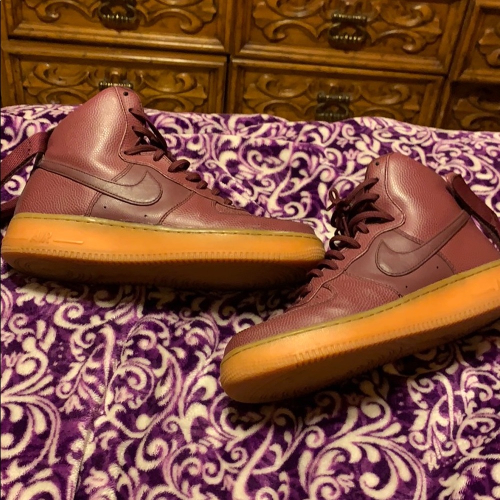 burgundy high top Nike Air Forces